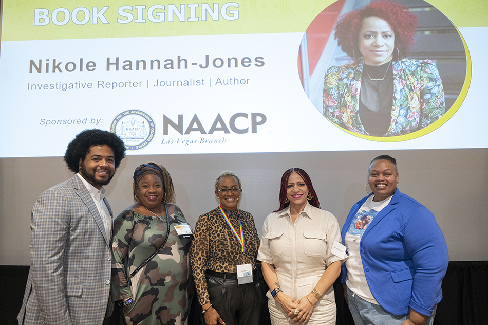 Community leaders posing for a group picture with the 2024 Diversity Summit keynote speaker